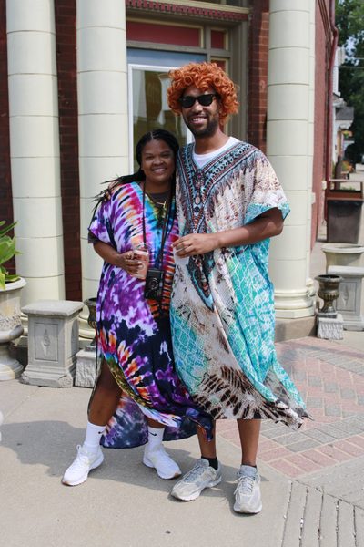 Mrs. Roper Romp attendees pose in their colorful caftans Saturday in downtown Weston. The annual event draws fans dressed in fashions inspired by Helen Roper and other characters from the television comedy “Three’s Company.”