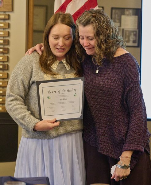 Megan Jantos, left, presents Emma Lowe with the posthumous Heart of Hospitality Award honoring Sue Blunt during the third annual Ministry Appreciation and Awards Luncheon on Oct. 18 at Weston United Methodist Church.