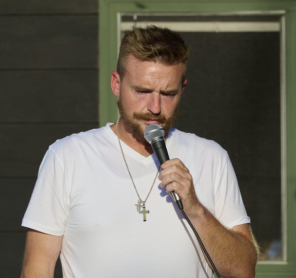William McQueen speaks during a worship service at the pond near Norman Landcraft Sept. 11, 2026.